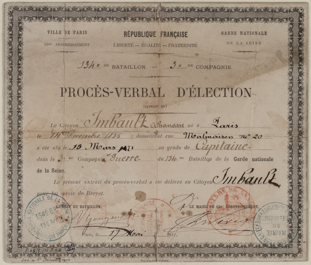 Altes Dokument mit einem Stimmzettel mit handgeschriebener Text und zwei roten Stempeln.