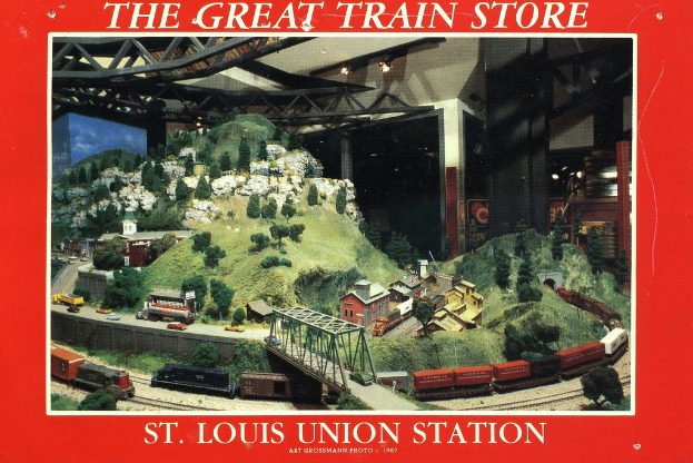 Ein Plakat mit einer Eisenbahn, die eine Brücke mit einer Truss-Struktur überquert, umgeben von Pflanzen, Häusern und Hügeln.