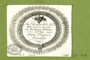 Plakat mit grünem Hintergrund, das den Text "Am meisten genehmigt in ausländischen Weinen" und ein rundes Logo mit einem weißen Zentrum und einem schwarzen Rand zeigt.