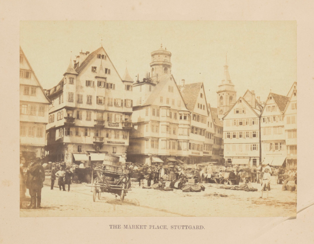 Old black-and-white photograph of a crowded market square in Stuttgart, Germany, with multi-story buildings, pedestrians, handcarts, and various goods; faded text appears along the bottom edge.